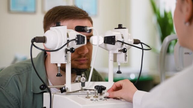 Ophthalmologist checking patient's eyesight on synoptophore machine