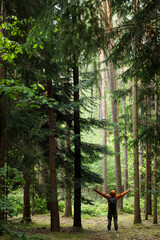 Fototapeta premium Man hiking in the Forest. Travel, tourism, adventure and healthy active lifestyle in nature