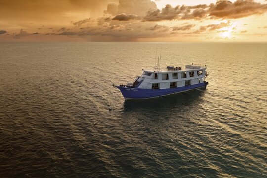 Narayana liveaboard ship, diving ship, at anchor, Pacific Ocean, Sulu Sea, Tubbataha Reef National Marine Park, Palawan Province, Philippines
