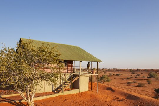 Some of the chalets of the Bagatelle Kalahari Game Ranch are built on top of a sand dune. Kalahari Desert, Namibia