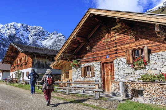 Farmhouse in front of snowy mountains, alpine pasture, autumn, maple trees, sunny, Engalm, Gro&szlig;er Ahornboden, Karwendel Mountains, Tyrol, Austria