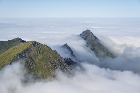 Mountain landscape in clouds, view from the top of Stornappstinden, Lofoten, Nordland, Norway