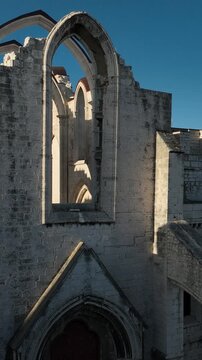 Cinematic Aerial View of Ancient Gothic Church in Lisbon Portugal at Golden Hour