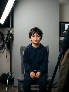 Young boy posing for portrait in studio setting
