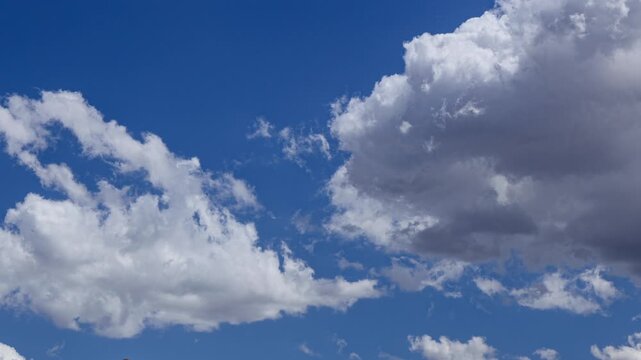 Active Clouds in a Brilliant Blue Sky Background