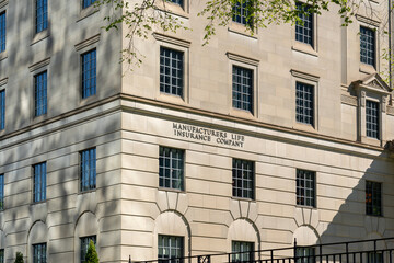Fototapeta premium Toronto, Canada - May 18, 2026: Headquarters of Manulife Financial Corporation on Bloor Street East in Toronto, Canada. Manulife Financial Corporation is a Canadian multinational financial services p