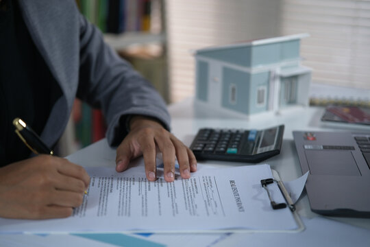 Signing home sales and insurance contracts with real estate agents, signing contracts to know the terms of buying and selling homes and real estate, contract signing ideas.
