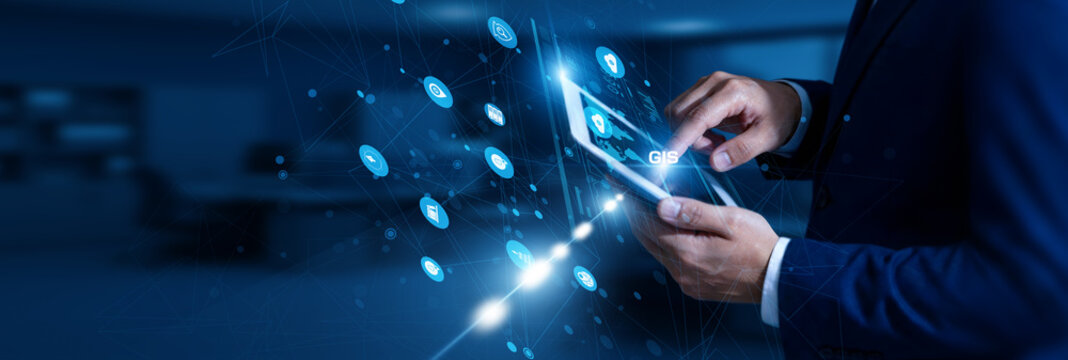 GIS Analyst touching GIS using tablet geospatial network, mapping, spatial data, analysis, satellite imaging, visualization.