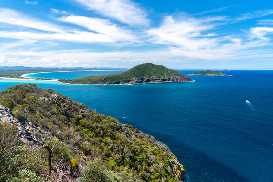 Scenic view of Yacaaba Headland from Mount Tomaree in Port Stephens, Australia with deep blue ocean and rugged coastline.