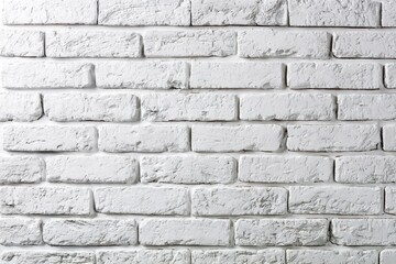 Fototapeta premium Clean White Brick Wall: A pristine white brick wall presents a textured and uniform surface, offering a versatile backdrop for design and photography.