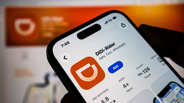 Closeup of a smartphone screen displaying the didirider app page in the apple app store, showing app details, ratings, and download button