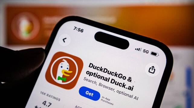 Closeup of a smartphone screen showing the duckduckgo app store page with search, browser, and ai features