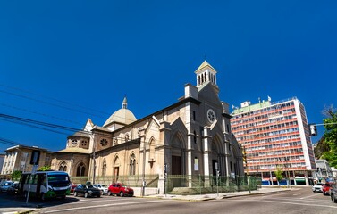 Fototapeta premium St. James Cathedral in Valparaiso, Chile. The historic Gothic Revival stone church stands on a street corner near Avenida Argentina under a clear blue sky