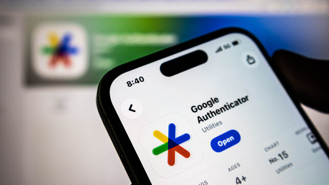 Closeup of a smartphone screen displaying the google authenticator app store page, showcasing the app icon and download interface