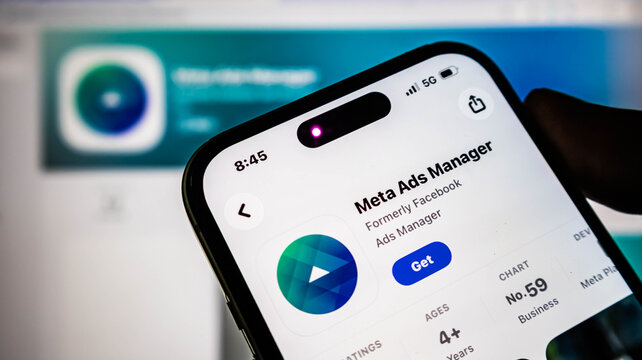 Closeup of a smartphone screen displaying the meta ads manager app store page, showcasing the digital marketing tool for facebook and instagram