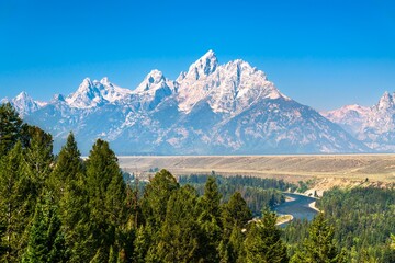 Obraz premium View of the Teton Mountain Range above the Snake River in Grand Teton National Park - Wyoming, United States