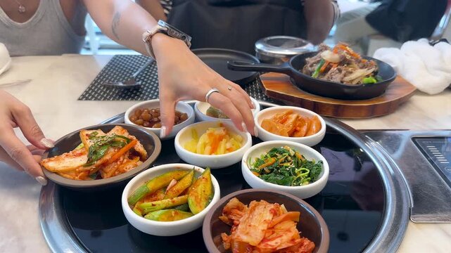 Assorted Korean Banchan Side Dishes Served on a Restaurant Table