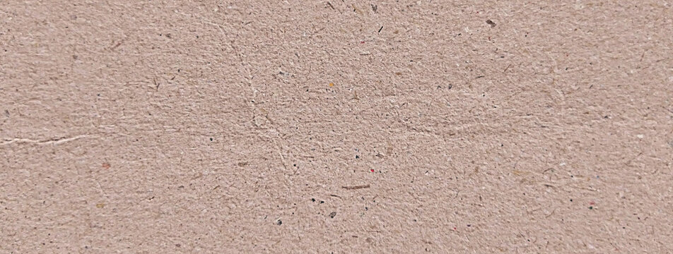 Recycled brown kraft paper texture, natural fibrous cardboard background, rustic tan paper surface for eco-friendly packaging and stationery design