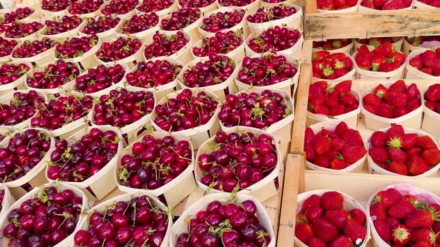 Fresh Organic Strawberries and Cherries in Wooden Crates at Cassis Market