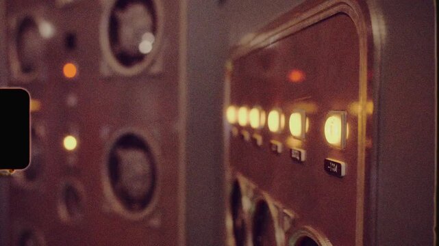 Vintage computer lights blinking on old control panel