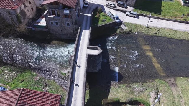 4K 60p drone orbit shot of Puente de la Rabia bridge in Zubiri, Camino de Santiago