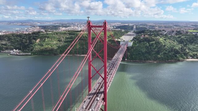 25Th April Bridge At Lisbon In Lisbon District Portugal. Megalopolis Downtown Cityscape. Vehicles Travel. 25Th April Bridge At Lisbon In Lisbon District Portugal. Cable Bridge Scenery.