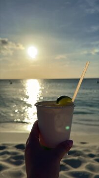 dink in a paperclip on the beach in aruba