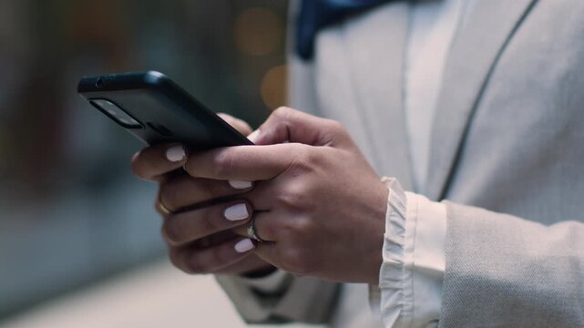 Businessman holding a gun while using smartphone and digital devices in a business setting