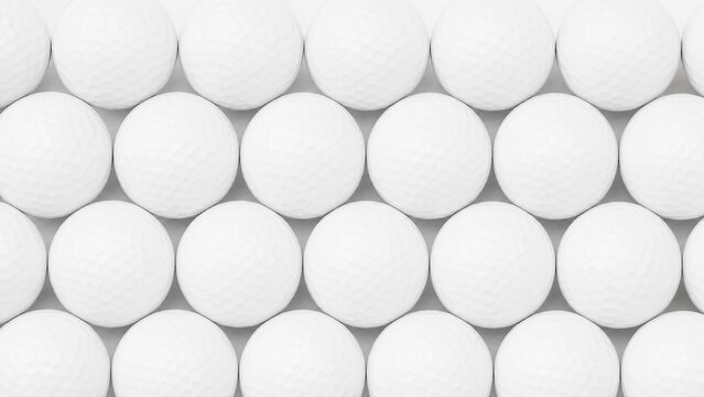 A collection of golf balls arranged in a pattern from above.