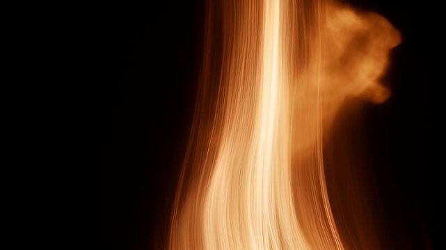 Abstract orange fire light texture smoke on black background with flowing glow, soft motion, flame ember heat, and dark abstract background for SEO visual stock footage title