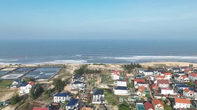 Nam Trach, Quang Binh (Quang Tri), Vietnam &ndash; 4K aerial drone footage of river mouth, East Sea, sandy beach, fishing village, boats, beachfront roads and seaside landscape near Dong Hoi City