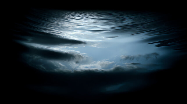 A serene underwater scene capturing reflections of clouds and light, creating a tranquil atmosphere beneath the water's surface.