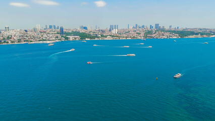 Istanbul, Turkey. European shore of Bosphorus Strait with passenger ferries and water taxis sailing on clear sunny day. Aerial View © Video Render