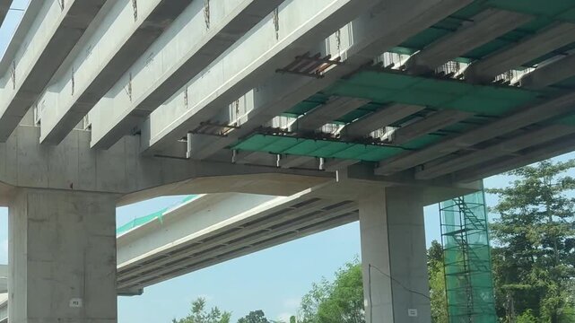 Elevated toll road construction & instalation of concrate pillars and girders