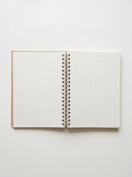Open spiral bound dot grid notebook mockup on white background