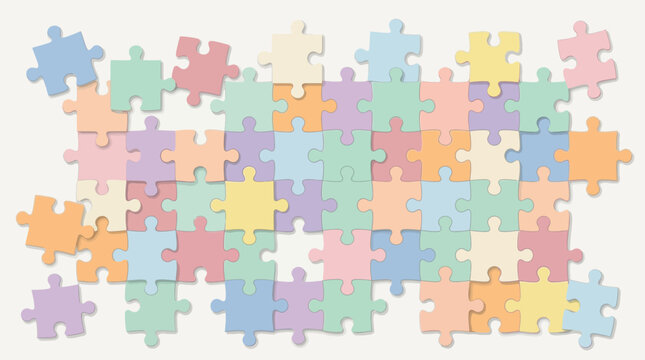 A colorful jigsaw puzzle with various shaped pieces scattered on a flat surface