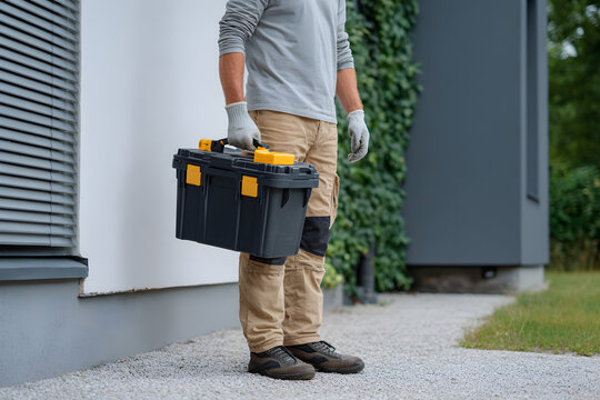 Man Holding Toolbox Ready For Work Or Home Improvement Tasks