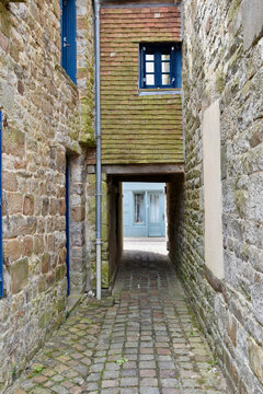 Pedestrian Alley with an Underpass beneath the Overgate of Bridge-Linked Houses in French Village