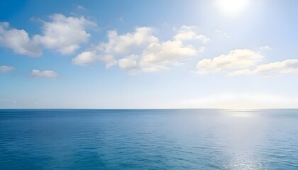 Obraz premium Beautiful blue ocean and clear sky with white clouds on a sunny day