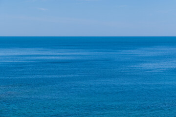 Calm deep blue sea water horizon line