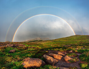 Fototapeta premium Stunning Full Double Rainbow over Green Mountain Plateau in Madeira