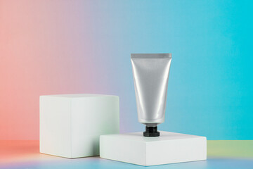 Skin care or sunscreen cosmetic with stylish props on colorful background. © apinya