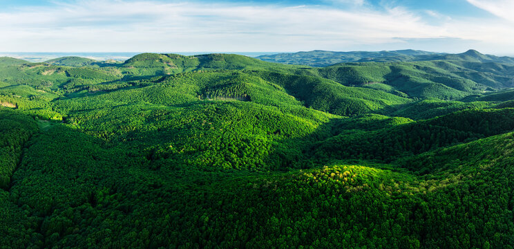 Mountain landscape with rocks, cross on top of mountain, sunlit hills. Picturesque landscape of Male (Little) Karpaty, Slovakia, Slovakia mountain range.