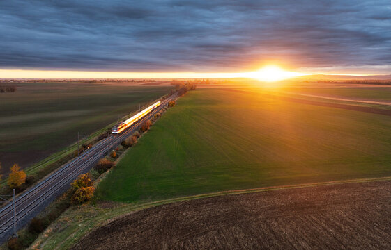 Railroad track from above with sunset. Train cargo transportation