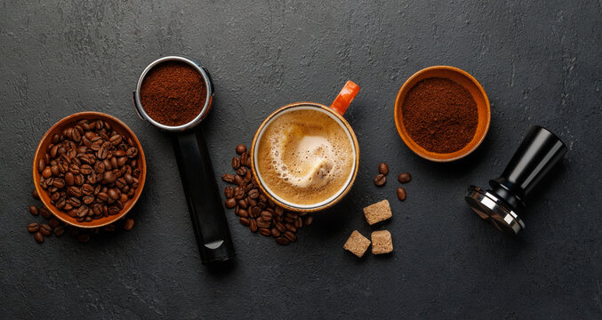 Espresso preparation tools and coffee beans flat lay composition