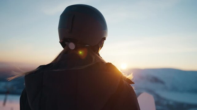 Pensive woman conqueror at mount top, back view, make decision and move to goal. Do extreme sports for adrenaline and emotions, unity of person and nature, sportswoman admiring beautiful scenery