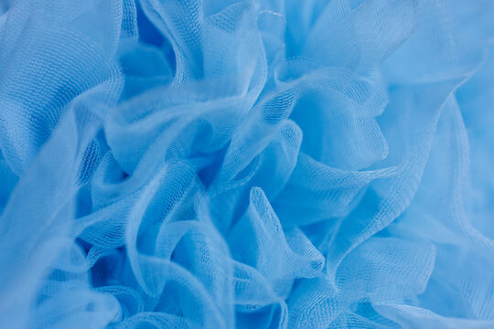 Abstract blue ruffled tulle fabric texture background
