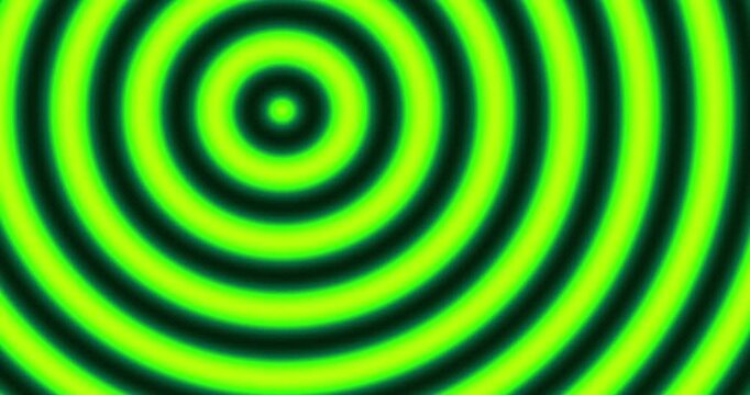Abstract concentric circle patterns shifting through vibrant neon color spectrums.