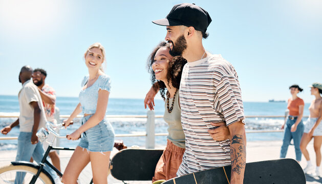 Skateboard, walk and love with couple at beach for bonding, summer vacation and support. Happy, date and weekend break with man and woman on promenade for journey, travel holiday and trust together