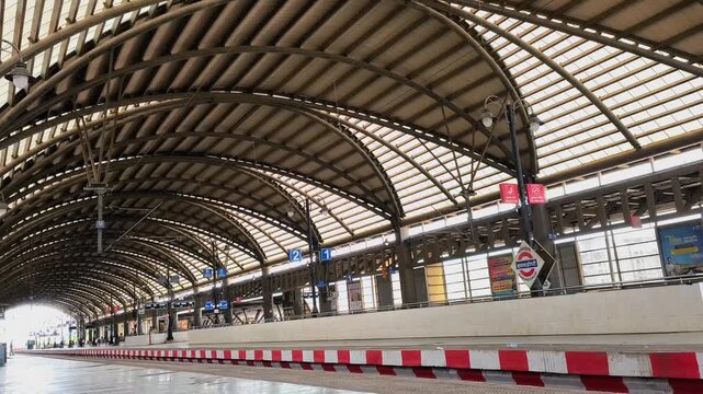 Timelapse of Local Navi Mumbai railway station platform with commuter trains and passengers, Maharashtra, India

